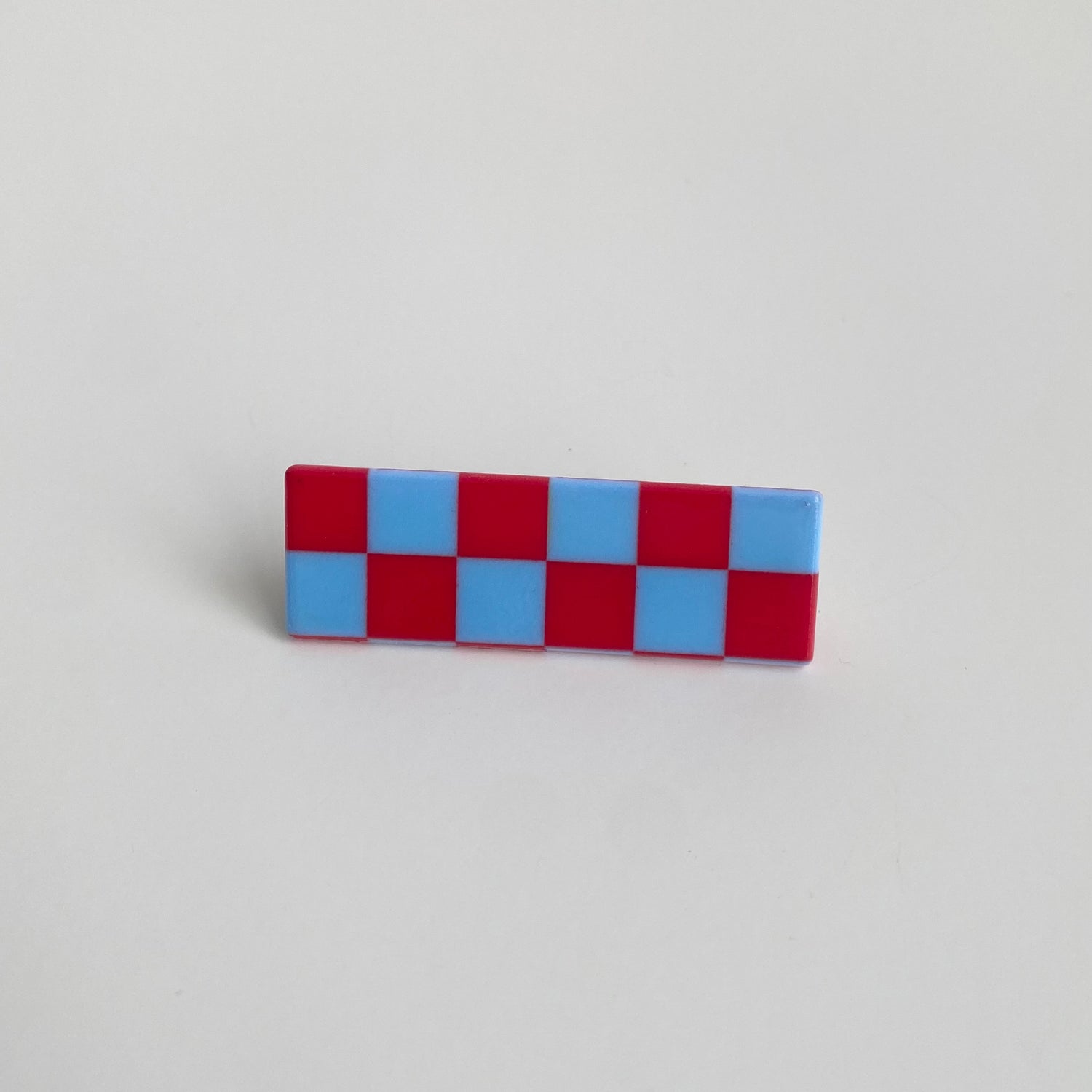 Checkered hairpin in blue & red checkered rectangle