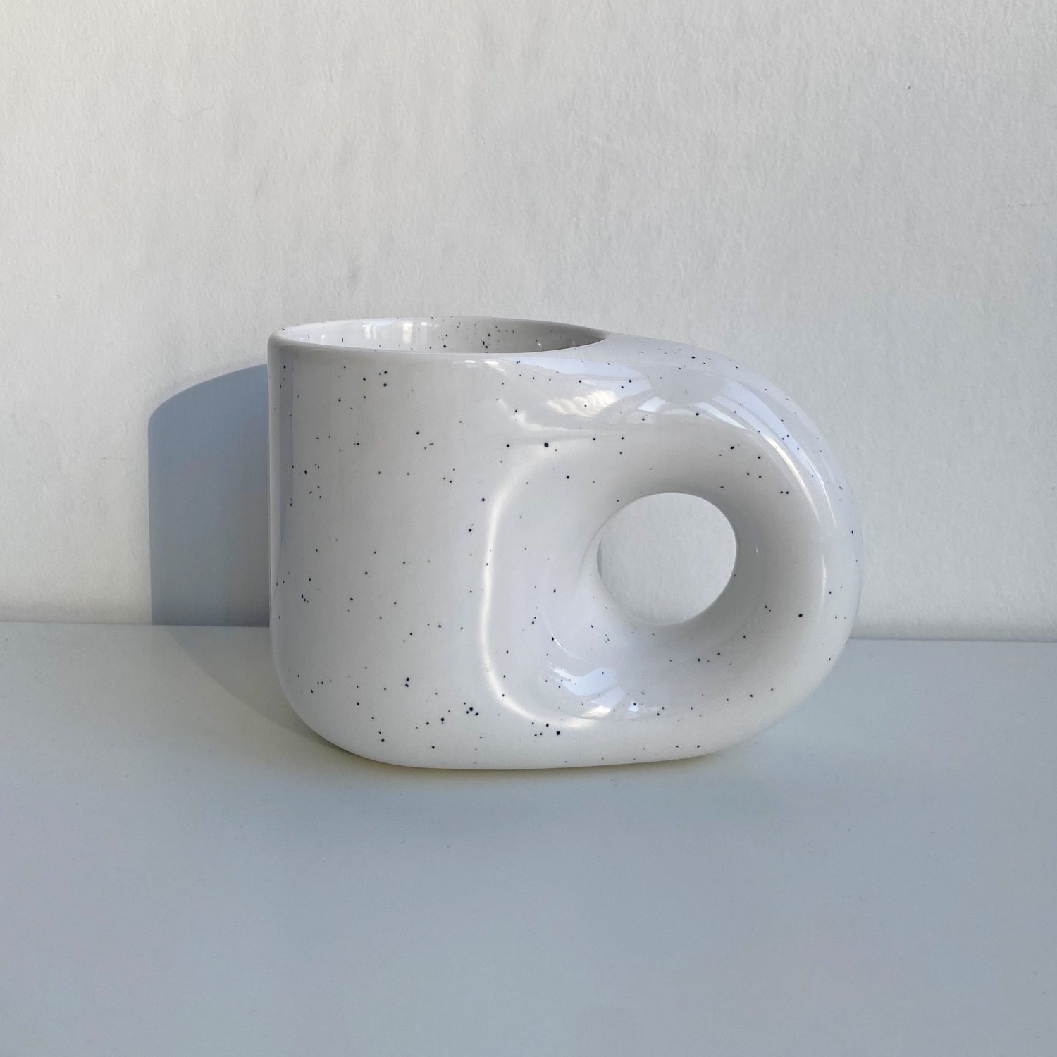 nordic style donute handle mug in speckled white