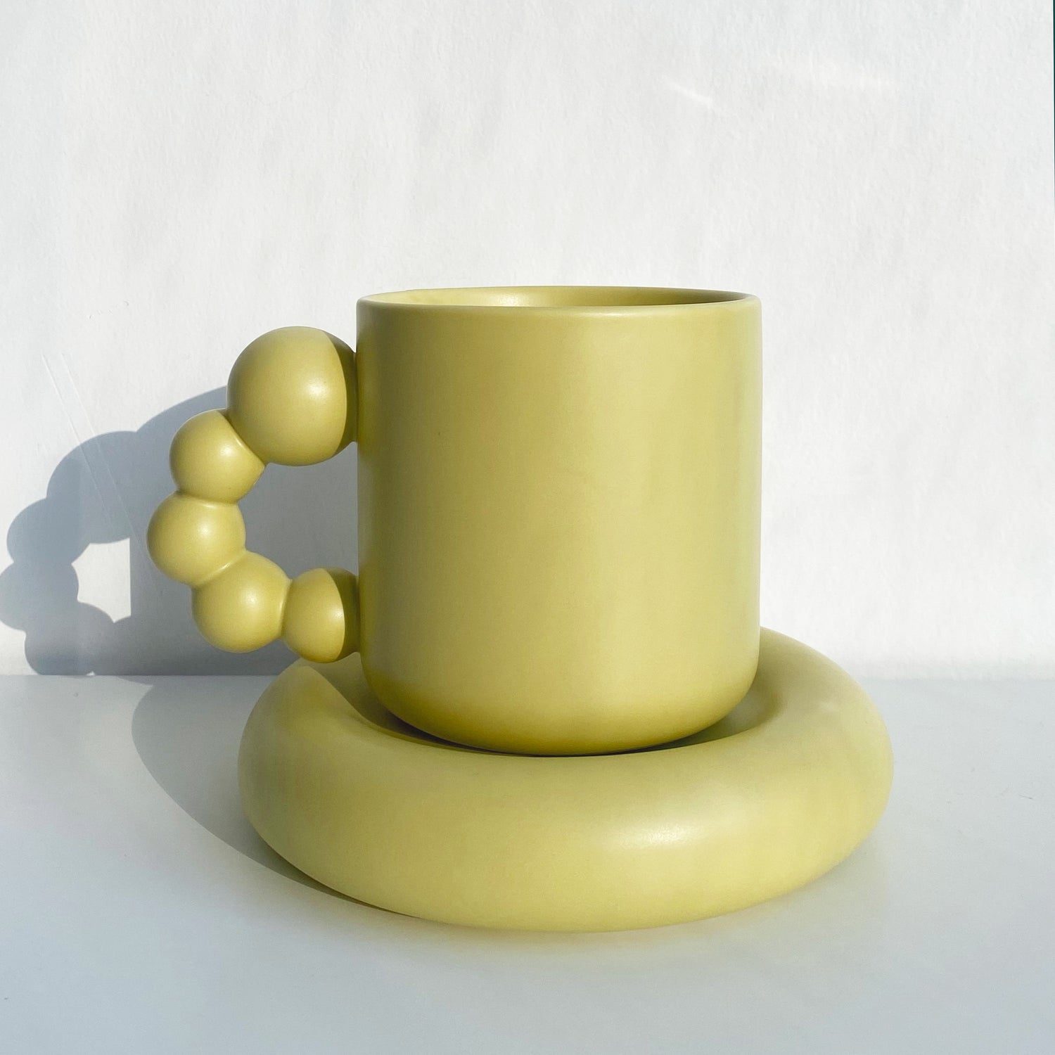 pearl handle ceramic mug in melon green