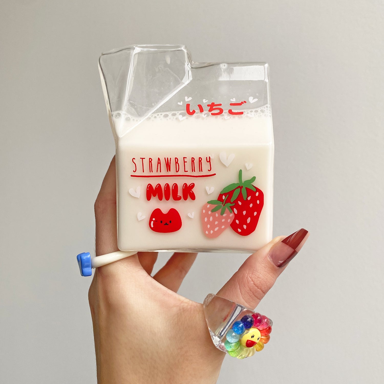 glass milk carton with cute strawberry design