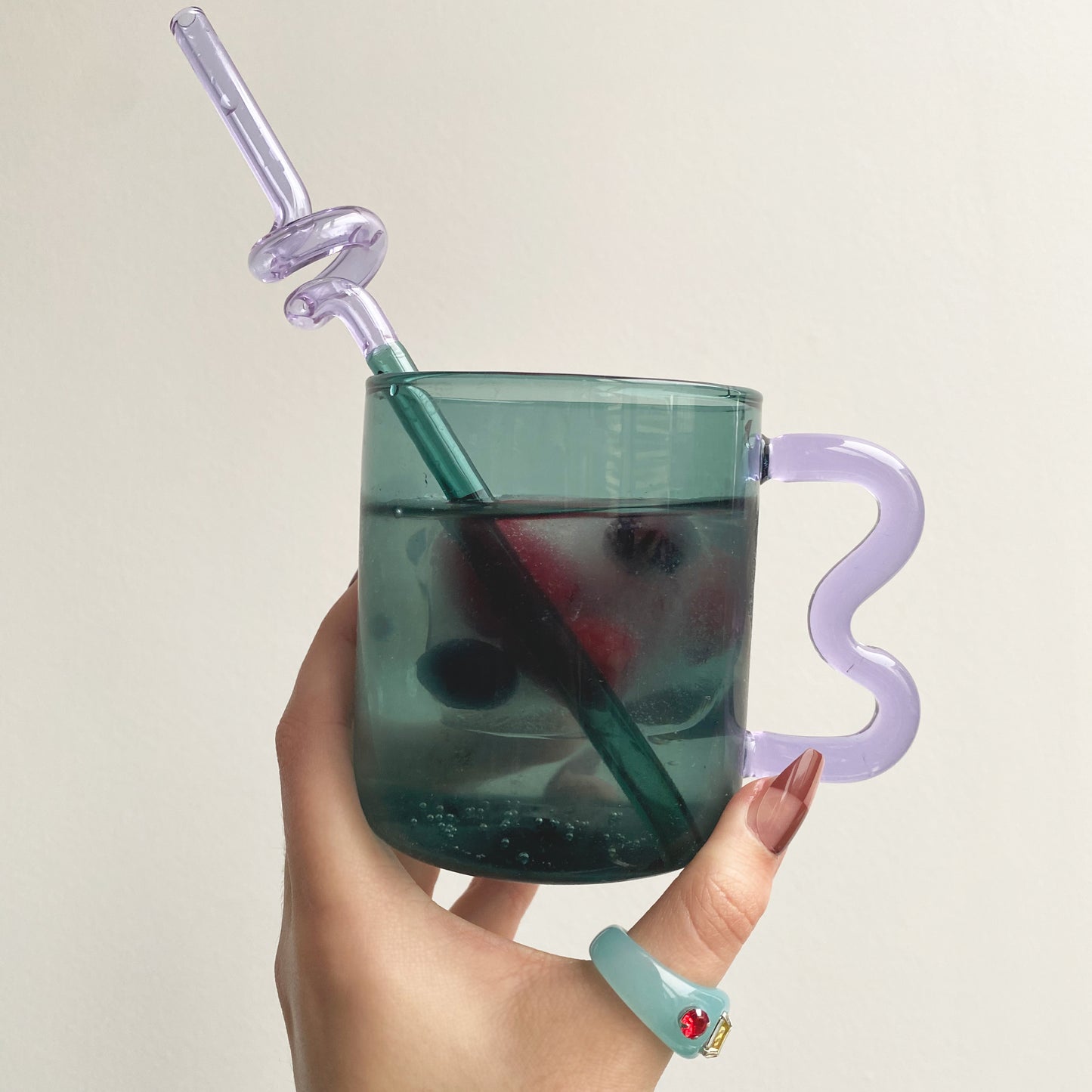 wave handle glass mug in blue with purple handle